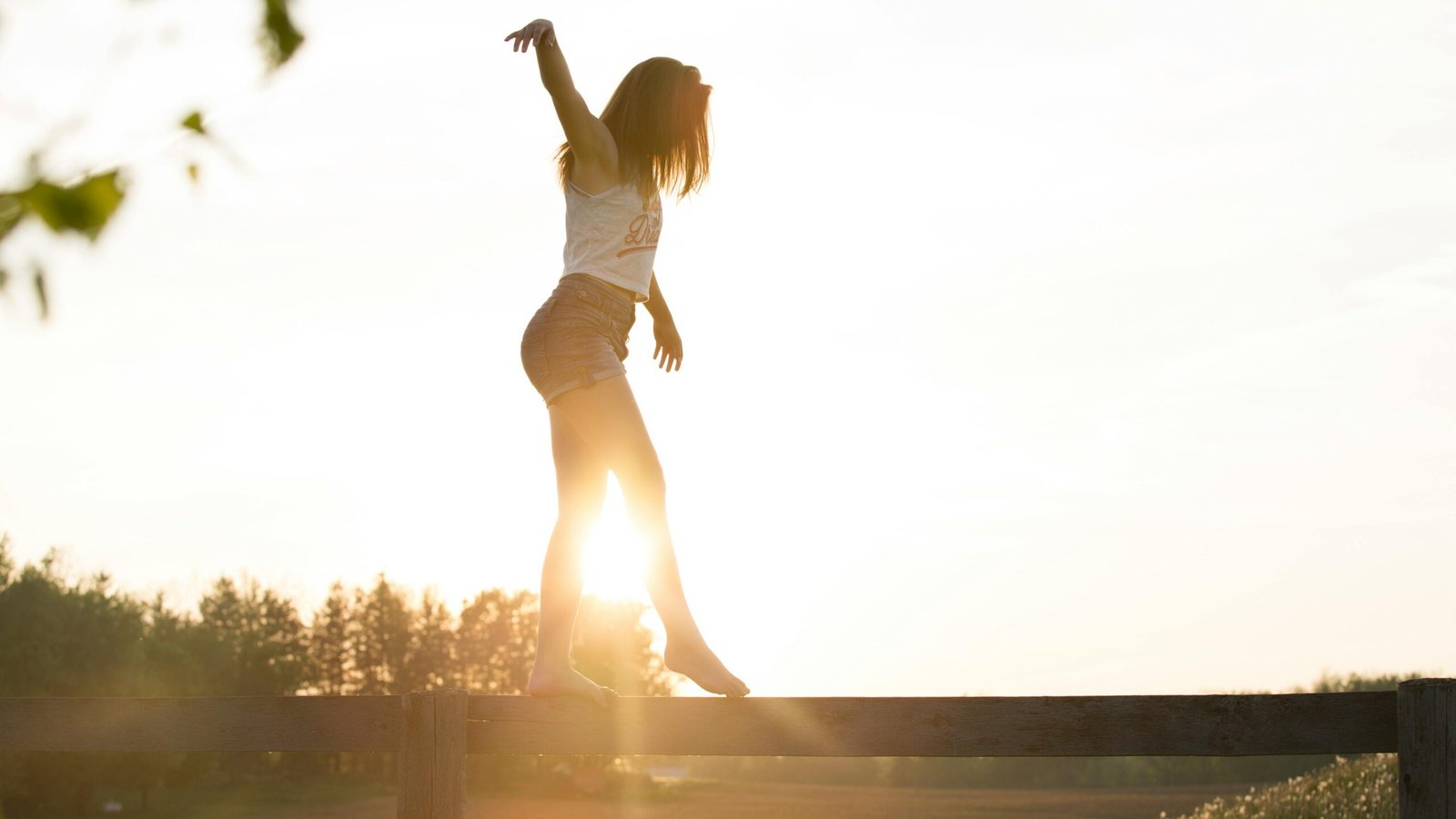 woman balancing outdoors in sunlight supporting immune system and overall health
