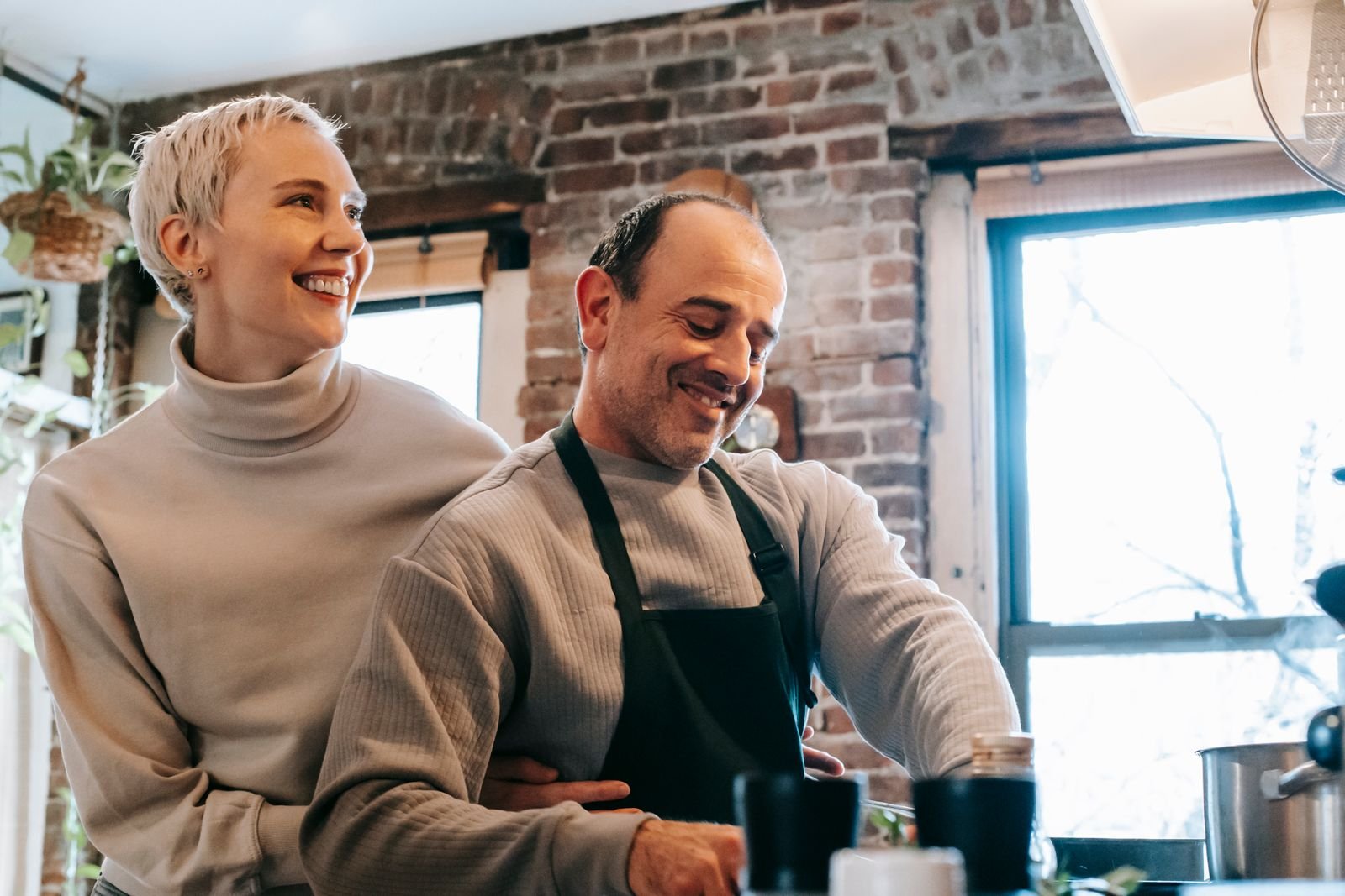 Couple over 50 cooking a healthy meal together at home