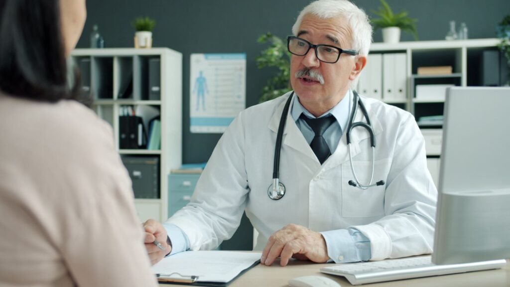 Doctor going over cholesterol test results explained line by line with a patient