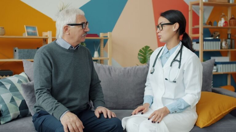 Man in his 60s discussing his cholesterol results with a doctor